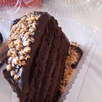 Guy Fieri's Flavortown Kitchen - Delicious chocolate layer cake - Food Delivery Services Near Me Guy Fieri's Flavortown Kitchen - Delicious chocolate layer cake - Food Delivery Services Near Me