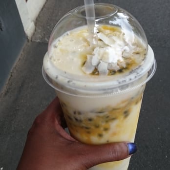 Ayomo - The Golden Eye - a large smoothie made with almond milk, passionfruit, bananas and topped with coconut flakes and chia seeds. - Restaurants Near Me - South Melbourne, VIC