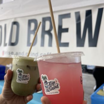 Rise & Grind Coffee - Ala Moana - a hand holding a cup of cold brew - Coffee & Tea Near Me - Honolulu, Hawaii Rise & Grind Coffee - Ala Moana - a hand holding a cup of cold brew - Coffee & Tea Near Me - Honolulu, Hawaii