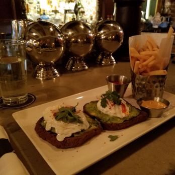 Tanner Smiths - Poached eggs on avocado toast - Cocktail Bars Near Me - New York, New York