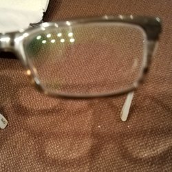 Eye to Eye Vision Center - Gouge in lens. Again, photo does not fully show damaged lens.