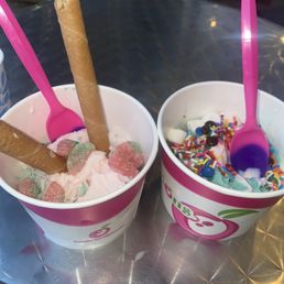 One strawberry tart and one mermaid tart yoghurt with toppings