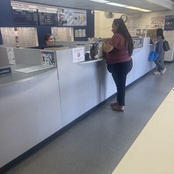 US Post Office - assisting and providing tape for another customer - Post Offices Near Me - Fontana, California