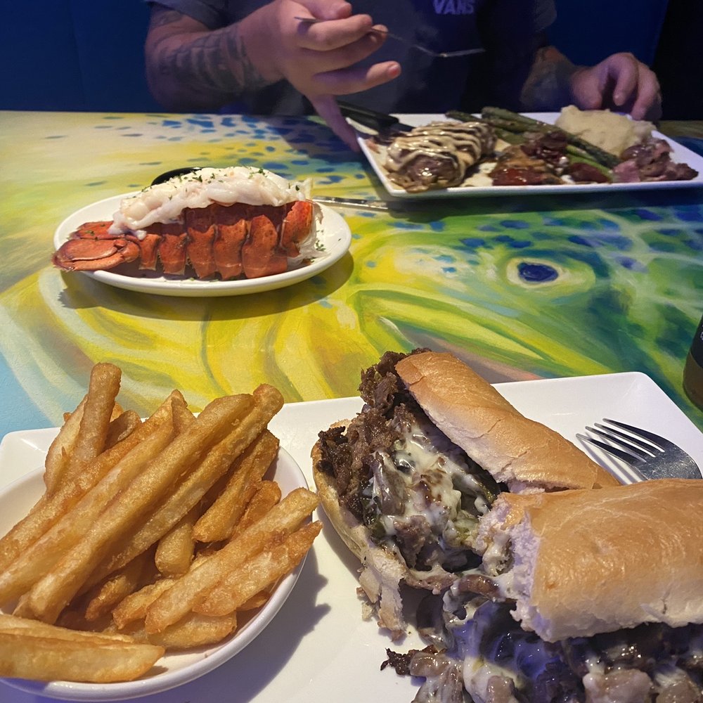 Coconuts On The Beach - Chef 's House Steak with lobster & Beach Cheese Steak - Bars Near Me - Cocoa Beach, Florida Coconuts On The Beach - Chef 's House Steak with lobster & Beach Cheese Steak - Bars Near Me - Cocoa Beach, Florida