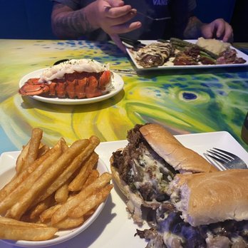 Coconuts On The Beach - Chef 's House Steak with lobster & Beach Cheese Steak - Bars Near Me - Cocoa Beach, Florida Coconuts On The Beach - Chef 's House Steak with lobster & Beach Cheese Steak - Bars Near Me - Cocoa Beach, Florida
