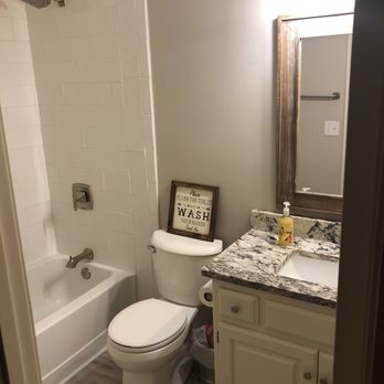 Complete Floorcovering - a bathroom with a sink, toilet, and bathtub - Carpeting Near Me - Lees Summit, Missouri