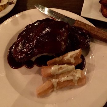 Orinoco - Costillitas - apple cider juice slow-steamed baby-back ribs with guava BBQ sauce & yuca fries - Caribbean Near Me - Brookline, Massachusetts Orinoco - Costillitas - apple cider juice slow-steamed baby-back ribs with guava BBQ sauce & yuca fries - Caribbean Near Me - Brookline, Massachusetts