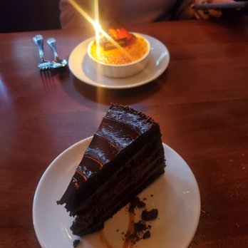 Oak Steakhouse - Chocolate layer cake and creme Brule - Steakhouses Near Me - Charleston, South Carolina Oak Steakhouse - Chocolate layer cake and creme Brule - Steakhouses Near Me - Charleston, South Carolina