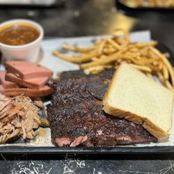 Daddy B’s - Ribs dinner with 2 meat add-ons, bologna and pulled pork, French fries, baked beans
