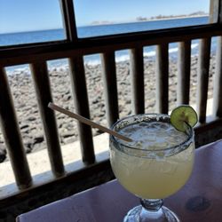 A Cadillac margaritas at Mary's Seafood, with seating right by the water.