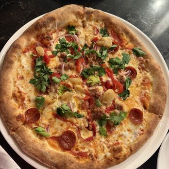 The Kitchen By Wolfgang Puck - Supreme pizza - Italian Near Me - Grand Rapids, Michigan The Kitchen By Wolfgang Puck - Supreme pizza - Italian Near Me - Grand Rapids, Michigan