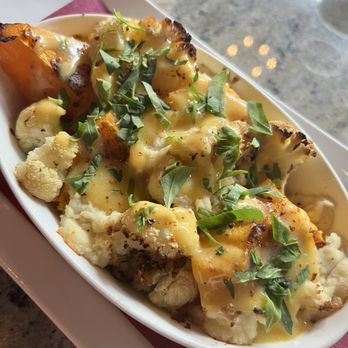 VINIA Wine & Kitchen - Roasted pumpkin and cauliflower with a plant based truffle cream sauce - Wine Bars Near Me - Winter Park, Florida VINIA Wine & Kitchen - Roasted pumpkin and cauliflower with a plant based truffle cream sauce - Wine Bars Near Me - Winter Park, Florida