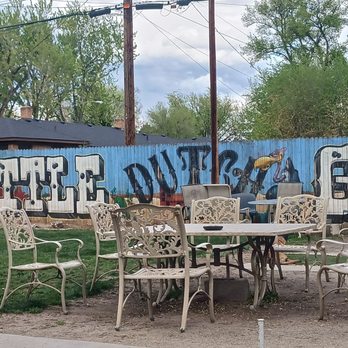 Little Dutch Garden - a table and chairs in front of a graffiti covered wall - Bars Near Me - Boise, Idaho Little Dutch Garden - a table and chairs in front of a graffiti covered wall - Bars Near Me - Boise, Idaho