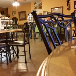a restaurant with tables and chairs a restaurant with tables and chairs
