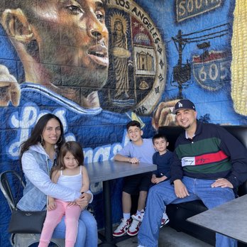 Dirt Dog Downey - Outside eating area with Kobe mural - Hot Dogs Near Me - Downey, California Dirt Dog Downey - Outside eating area with Kobe mural - Hot Dogs Near Me - Downey, California