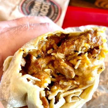 Chronic Tacos - Flavorful Al Pastore Burrito close-up - Mexican Near Me - Menifee, California Chronic Tacos - Flavorful Al Pastore Burrito close-up - Mexican Near Me - Menifee, California