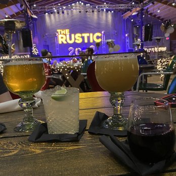 The Rustic - A few of our table looking at the stage where they did have a guy performing with an acoustic guitar - Bars Near Me - Houston, Texas The Rustic - A few of our table looking at the stage where they did have a guy performing with an acoustic guitar - Bars Near Me - Houston, Texas