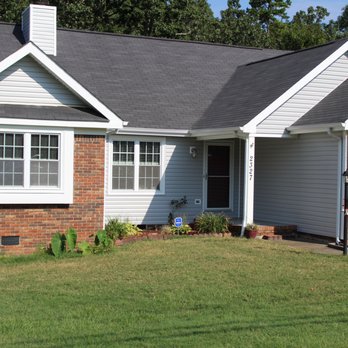 Free Enterprises - a brick home with a garage - General Contractors Near Me Free Enterprises - a brick home with a garage - General Contractors Near Me