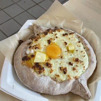 Skalka - Adjaruli Boat (Cheese and Egg) - Breakfast & Brunch Near Me - Seattle, Washington Skalka - Adjaruli Boat (Cheese and Egg) - Breakfast & Brunch Near Me - Seattle, Washington