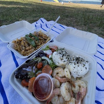 Open Kitchen Oahu - Garlic shrimp plate and hurricane fries. Enjoying the Open Kitchen food to-go at Haleiwa Beach - Comfort Food Near Me - Haleiwa, Hawaii