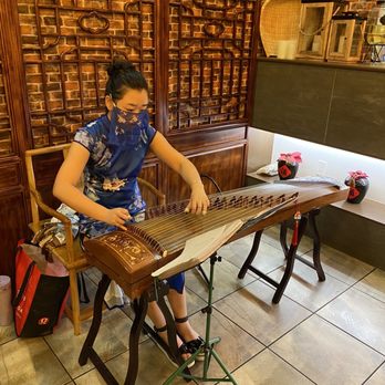 Dynasty BBQ - Lady playing guzheng - Chinese Near Me - Newark, California Dynasty BBQ - Lady playing guzheng - Chinese Near Me - Newark, California