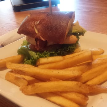 Chili's - Grilled chicken sandwich with avocado and bacon on a pretzel bun with a side of fries. - American Near Me - Lancaster, California Chili's - Grilled chicken sandwich with avocado and bacon on a pretzel bun with a side of fries. - American Near Me - Lancaster, California