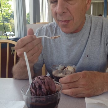 Carlone's Candy and Ice Cream - a man eating - Ice Cream & Frozen Yogurt Near Me - Painesville, Ohio Carlone's Candy and Ice Cream - a man eating - Ice Cream & Frozen Yogurt Near Me - Painesville, Ohio