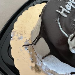 a chocolate cake with frosting a chocolate cake with frosting
