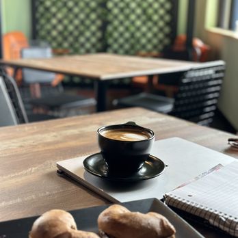 Common Grounds - a cup of coffee and pastries on a table - Coffee Roasteries Near Me - Jefferson Valley, New York