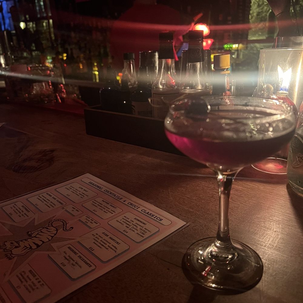 Crucible Bar - a glass of wine on a table - Cocktail Bars Near Me - Asheville, North Carolina Crucible Bar - a glass of wine on a table - Cocktail Bars Near Me - Asheville, North Carolina