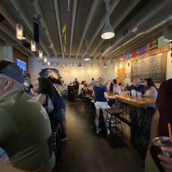 Mathews Brewing - people sitting at tables in a bar - Breweries Near Me - Lake Worth, Florida Mathews Brewing - people sitting at tables in a bar - Breweries Near Me - Lake Worth, Florida