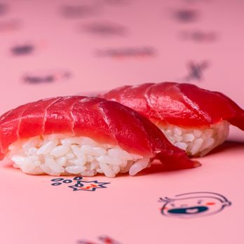 Krispy Rice - two pieces of sushi on a pink background - Sushi Bars Near Me - Portland, Oregon Krispy Rice - two pieces of sushi on a pink background - Sushi Bars Near Me - Portland, Oregon