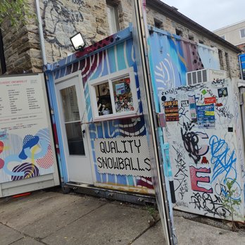 Quality Snowballs - a building with graffiti on it - Shaved Ice Near Me - Baltimore, Maryland