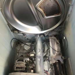 Dirty dryer interior with worn parts Dirty dryer interior with worn parts