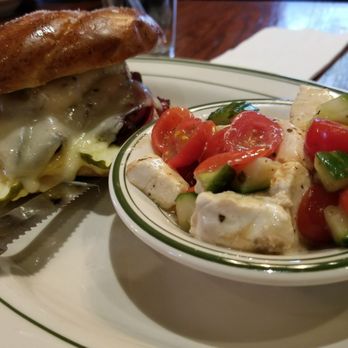 Coleman's Authentic Irish Pub - Coleman's hot pastrami sandwich with a side of tomato/cucumber salad - Pubs Near Me - Syracuse, New York