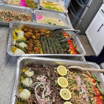 Shawarma King - Shwarma party platter and mixed grill party platter along with sides and Jerusalem salad. - Falafel Near Me - Gurnee, Illinois