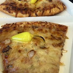 7-Eleven - 2 pieces of pizza for $5 ( with a drink)