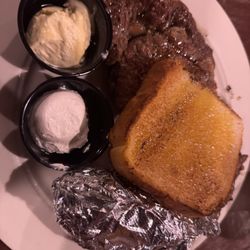 Ribeye, baked potato with toast