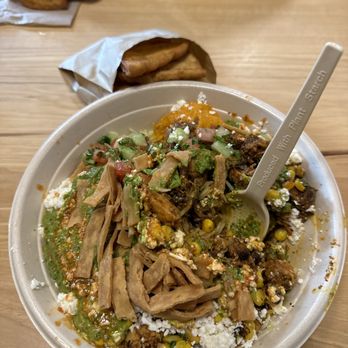 CAVA - Greens and grains with braised lamb and honey roasted chicken. Can't forget about my pita chips. Absolutely loveeeee - Mediterranean Near Me - Greenwich, Connecticut