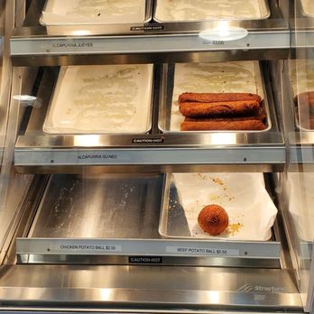 Cocina Cafe - a display case of hot dogs - Latin American Near Me - Palm Bay, Florida