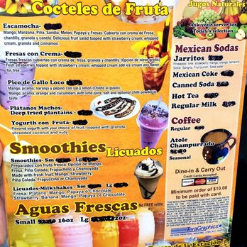 Mango Loco - Menu - The menu features a variety of fruit-based items including fruit salads topped with strawberry cream, whipped cream, and cinnamon, as well as smoothies and milkshakes with fresh fruit and optional toppings. It also offers fresh juices, Mexican sodas, and coffee, with options for dine-in or takeout. The menu is decorated with images of fruit and beverages, emphasizing fresh ingredients and a tropical theme. - Mexican Near Me - Lafayette, Indiana