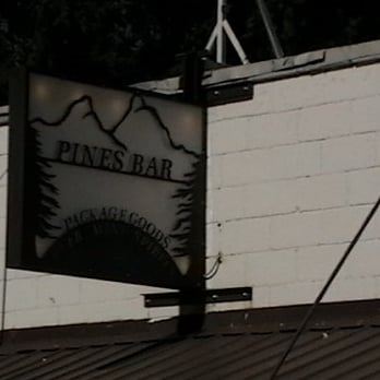 Pines Bar - a sign on the side of a building - Wine Bars Near Me - Thayne, Wyoming