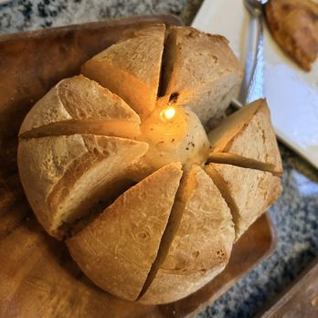 Piedra Santa - Their signature bread - served with a candle in the middle - Steakhouses Near Me - San Diego, California Piedra Santa - Their signature bread - served with a candle in the middle - Steakhouses Near Me - San Diego, California