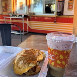 Cheddar croissant and white chocolate strawberry iced latte Cheddar croissant and white chocolate strawberry iced latte
