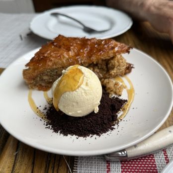 Stina - Walnut orange cardamom baklava with a scoop of vanilla ice cream and crushed Oreo wafers - Pizza Near Me - Philadelphia, Pennsylvania Stina - Walnut orange cardamom baklava with a scoop of vanilla ice cream and crushed Oreo wafers - Pizza Near Me - Philadelphia, Pennsylvania
