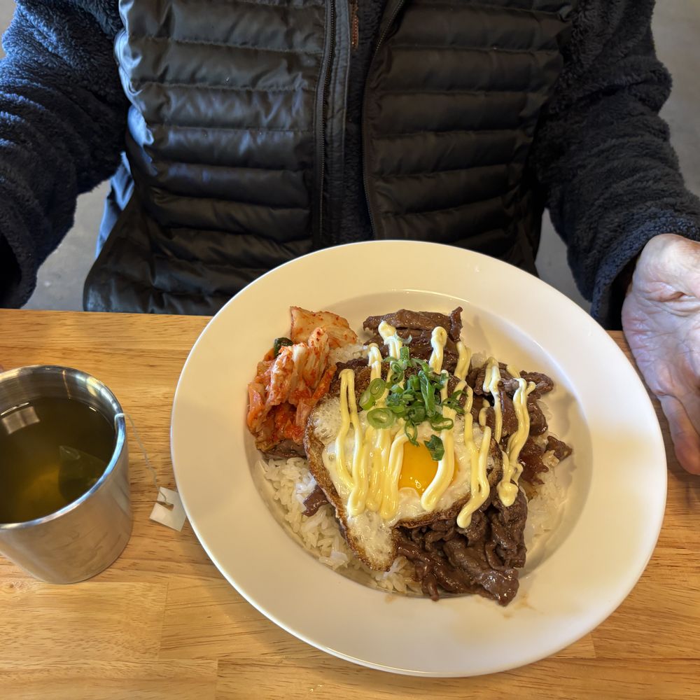 Lucky Cat Bistro - Beef bulgogi plate over rice with egg and kimchi - Vietnamese Near Me - Novato, California Lucky Cat Bistro - Beef bulgogi plate over rice with egg and kimchi - Vietnamese Near Me - Novato, California