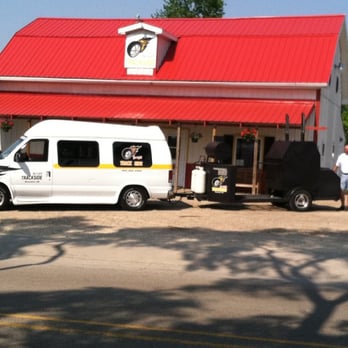 Trackside Bar & Grill - a white van parked in front of a restaurant - American Near Me - Peosta, Iowa Trackside Bar & Grill - a white van parked in front of a restaurant - American Near Me - Peosta, Iowa