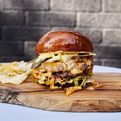 Gunther’s - Our spicy pickle smash burger! Best burg in Queen.