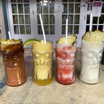 Down the Hatch Maui - Four happy hour beverages. From left to right: Mai Tai, passion fruit daiguiri, lava flow, Pina colada - Seafood Near Me - Lahaina, Hawaii