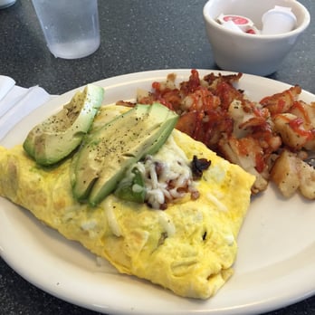 Chubby's - 3 egg omelette with mushrooms, green bell pepper, tomatoes, choice of cheese, and avocado on top! Grilles potatoes on the side - Breakfast & Brunch Near Me - Lemoore, California